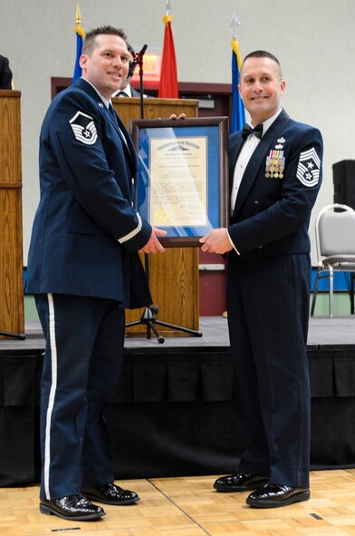 Chief Master Sgt. Ray Dawson (right), command chief master sergeant of the Kentucky Air National Guard’s 123rd Airlift Wing, presents Master Sgt. Eric Hamilton with a Kentucky Colonel certificate during the Kentucky National Guard Soldier and Airman of the Year Banquet, held March 22, 2014, in Louisville, Ky. Hamilton, a management specialist in the 123rd Logistics Readiness Squadron, is the Kentucky Air Guard’s Honor Guard Member of the Year for 2014. (U.S. Air National Guard photos by Staff Sgt. Vicky Spesard)