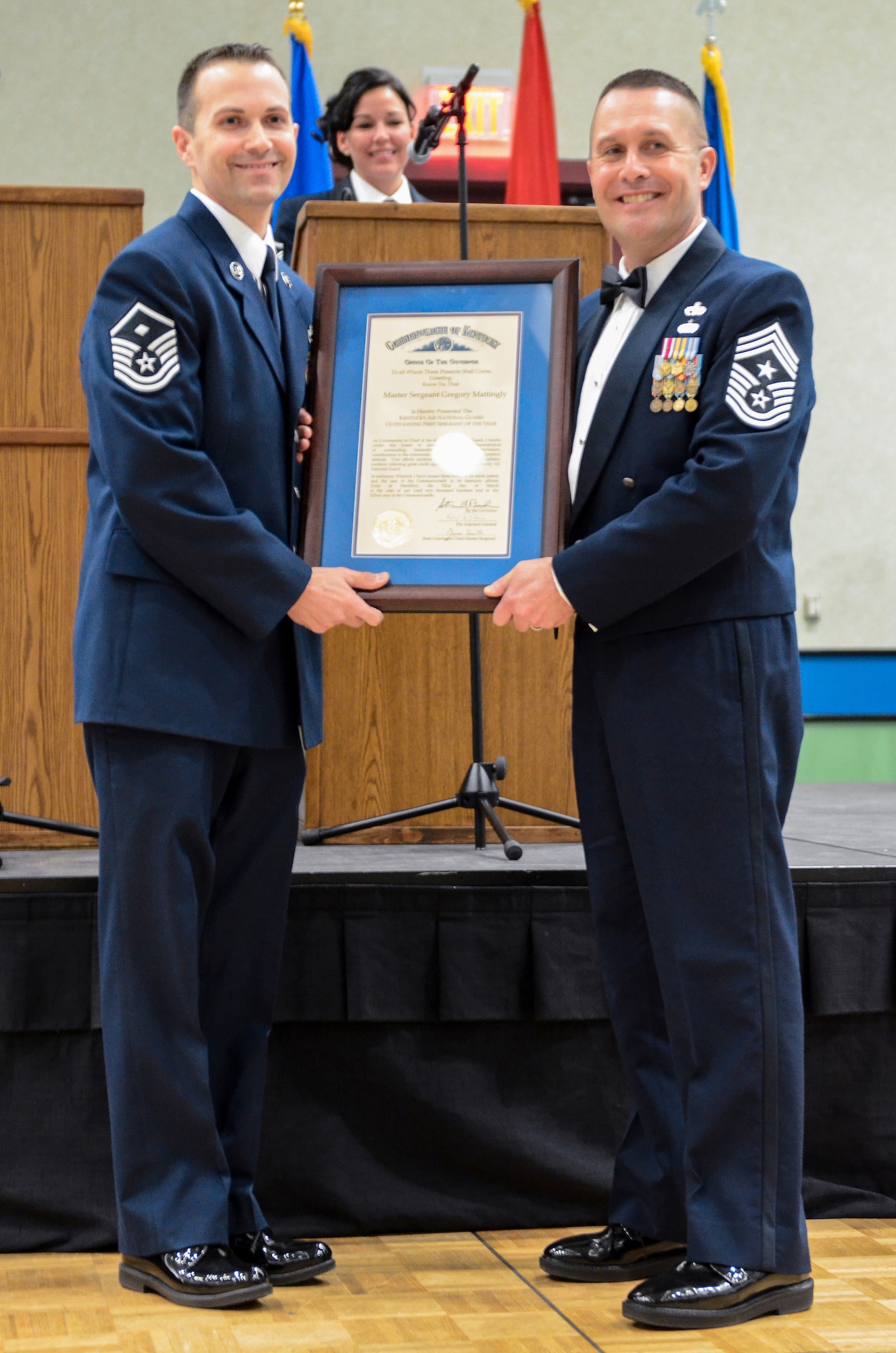 Chief Master Sgt. Ray Dawson (right), command chief master sergeant of the Kentucky Air National Guard’s 123rd Airlift Wing, presents Master Sgt. Gregory Mattingly with a Kentucky Colonel certificate during the Kentucky National Guard Soldier and Airman of the Year Banquet, held March 22, 2014, in Louisville, Ky. Mattingly, of the 123rd Mission Support Group, is the Kentucky Air Guard’s 2014 First Sergeant of the Year. (U.S. Air National Guard photos by Staff Sgt. Vicky Spesard)