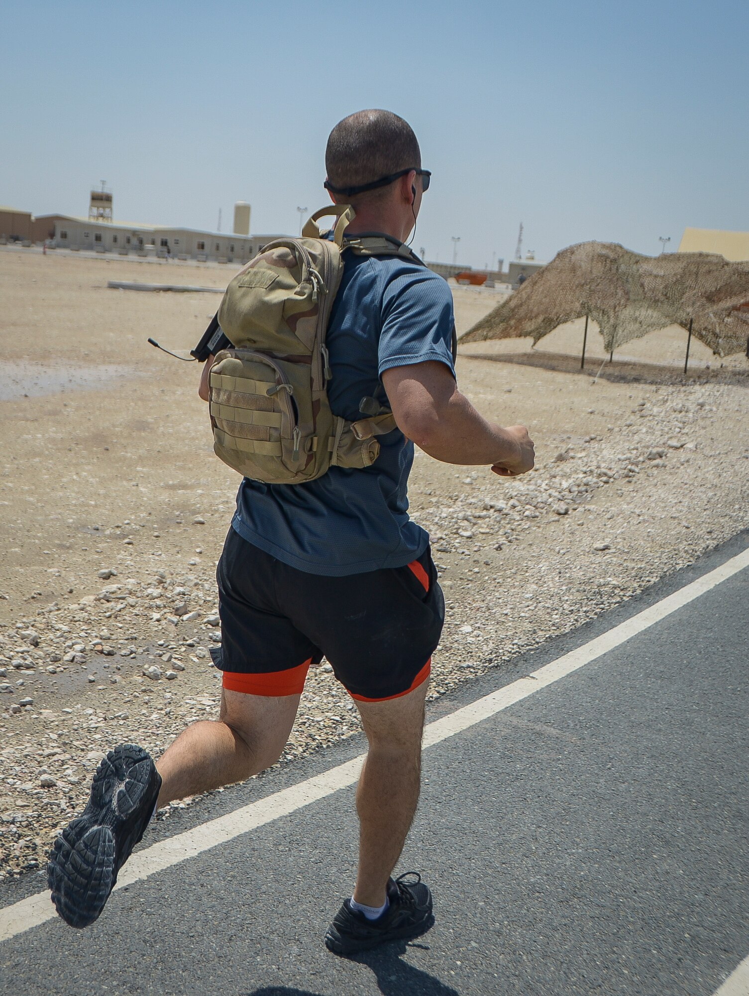 A 24-hour Tactical Air Control Party remembrance run participant finishes another lap at Al Udeid Air Base, Qatar, March 27, 2014. The event was held to ensure those warriors who have made the ultimate sacrifice are never forgotten. This year’s 24-hour TACP challenge was the third annual event dedicated to the 10 fallen TACP warriors who were killed in combat and training operations within the last 20 years. The event was held world-wide with every TACP unit starting the run March 27 at noon local time. (U.S. Air Force photo/Senior Airman Jared Trimarchi) 