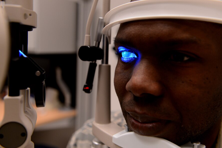 U.S. Air Force Tech Sgt. Jason Ellington, 52nd Aerospace Medicine Squadron optometry flight chief from Stuart, Fla., goes through a slit lamp test at Spangdahlem Air Base, Germany, March 25, 2014. A slit lamp test is used to detect scaring of the cornea and blood flow in the eye. (U.S. Air Force photo by Airman 1st Class Kyle Gese/Released)