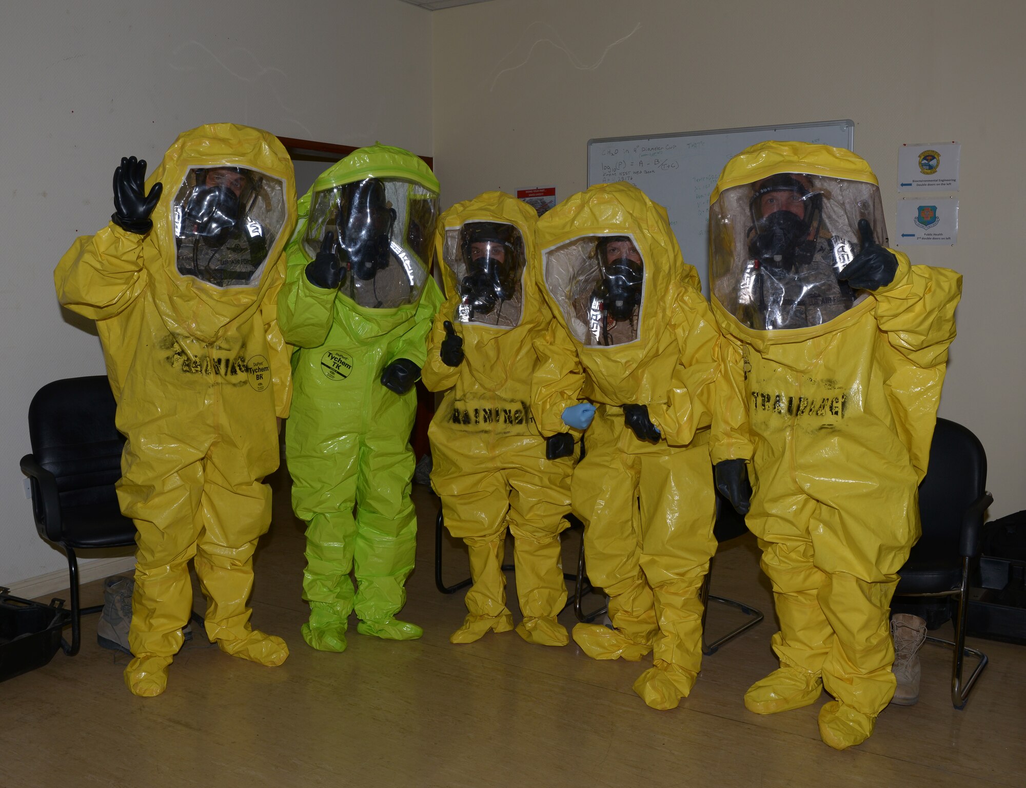 Senior leaders from the 379th Air Expeditionary Wing pose for a photo at Al Udeid Air Base, Qatar, during a tour of the 379th Expeditionary Medical Operation Squadron’s bioenvironmental element, Mar. 25, 2014. Leadership was briefed on the 379th EMDOS bioenvironmental element’s sound level meter, hazardous material identification system, wet bulb globe thermometer, respiratory protection and personal protective equipment capabilities. (U.S. Air Force photo/Senior Airman Hannah Landeros) 