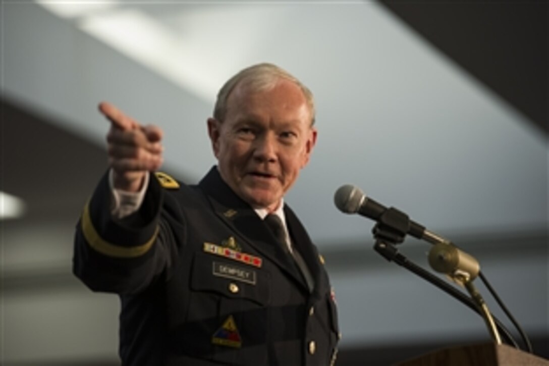 Army Gen. Martin E. Dempsey, chairman of the Joint Chiefs of Staff, makes a joke at the retirement ceremony of Army Gen. Keith Alexander, who is stepping down as head of U.S. Cyber Command and the National Security Agency, at the agency's headquarters on Fort George Meade, Md., March 28, 2014. 