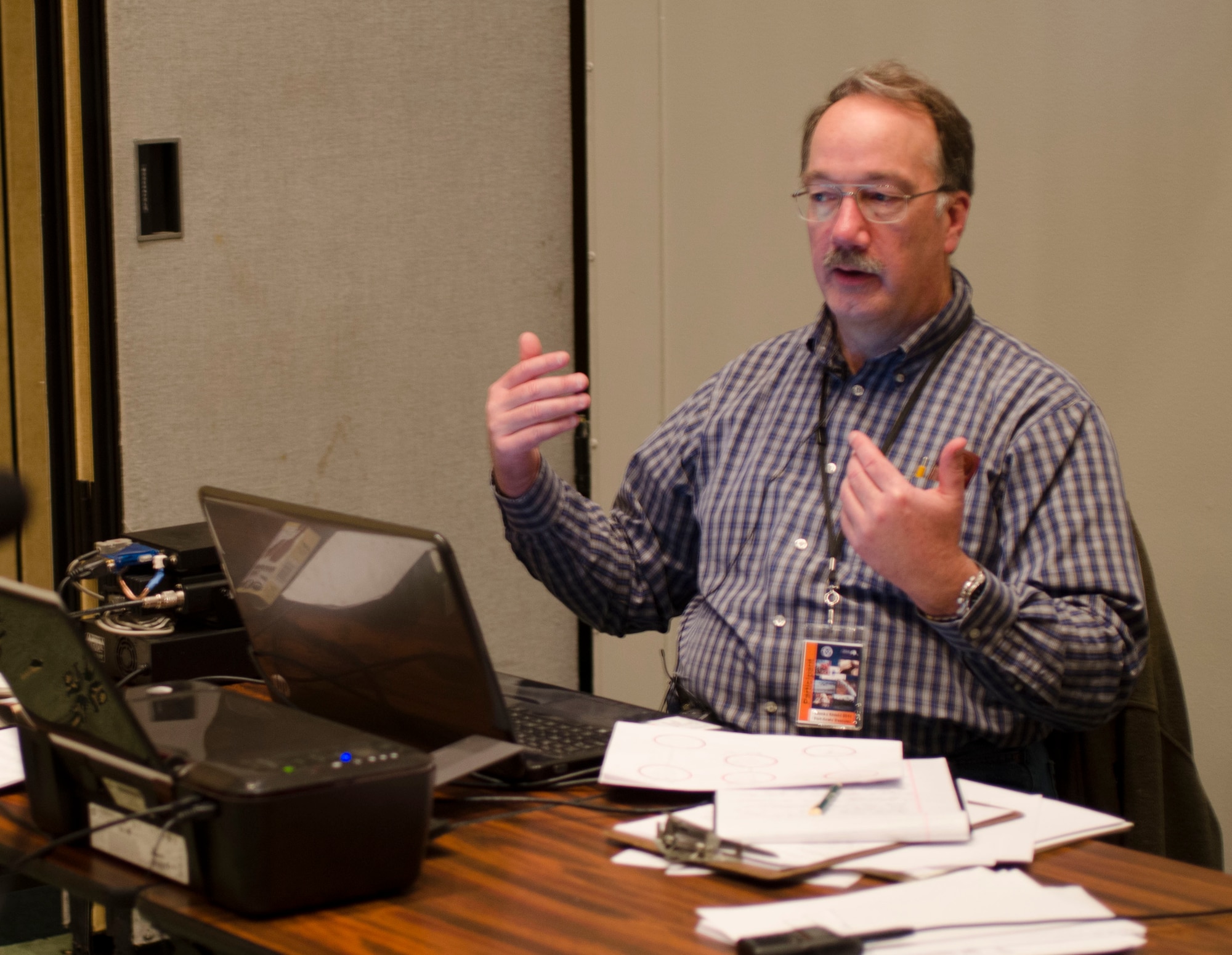 Robert Rountree, President of the amateur radio club in Valdez, Alaska, discusses his role during day one of Alaska Shield 14 here, March 28, 2014. Alaska Shield 14  is an exercise that involves state, federal, military, and local agencies, designed to test the response and coordination of the a disaster modeled after the 1964 earthquake and subsequent tsunami that devastated much of South Central Alaska including the city of Valdez. (U.S. Army photo by Spc. True Thao)