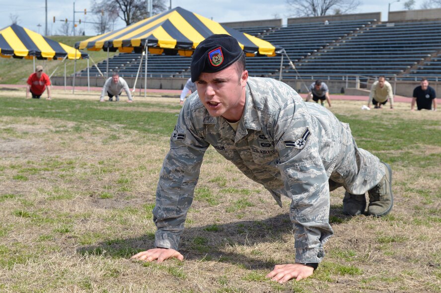Airman 1st Class Brian Musum, 14th Air Support Operations Squadron, leads Pope Field Tactical Air Control Party Airmen during a memorial push up ceremony after a 24-hour run at the Hedrick Stadium track during the third annual worldwide TACP 24-hour Run Challenge fundraising event March 28, 2014. The event is held to honor and raise funds for fallen TACP brothers in arms and their families. TACP Airmen from the 18th Air Support Operations Group, 14th Air Support Operations Squadron, 682nd Air Support Operations Squadron and the 18th Weather Squadron accumulated more than 2,500 miles during this year’s event at Pope. (U.S. Air Force photo/Marvin Krause) 

