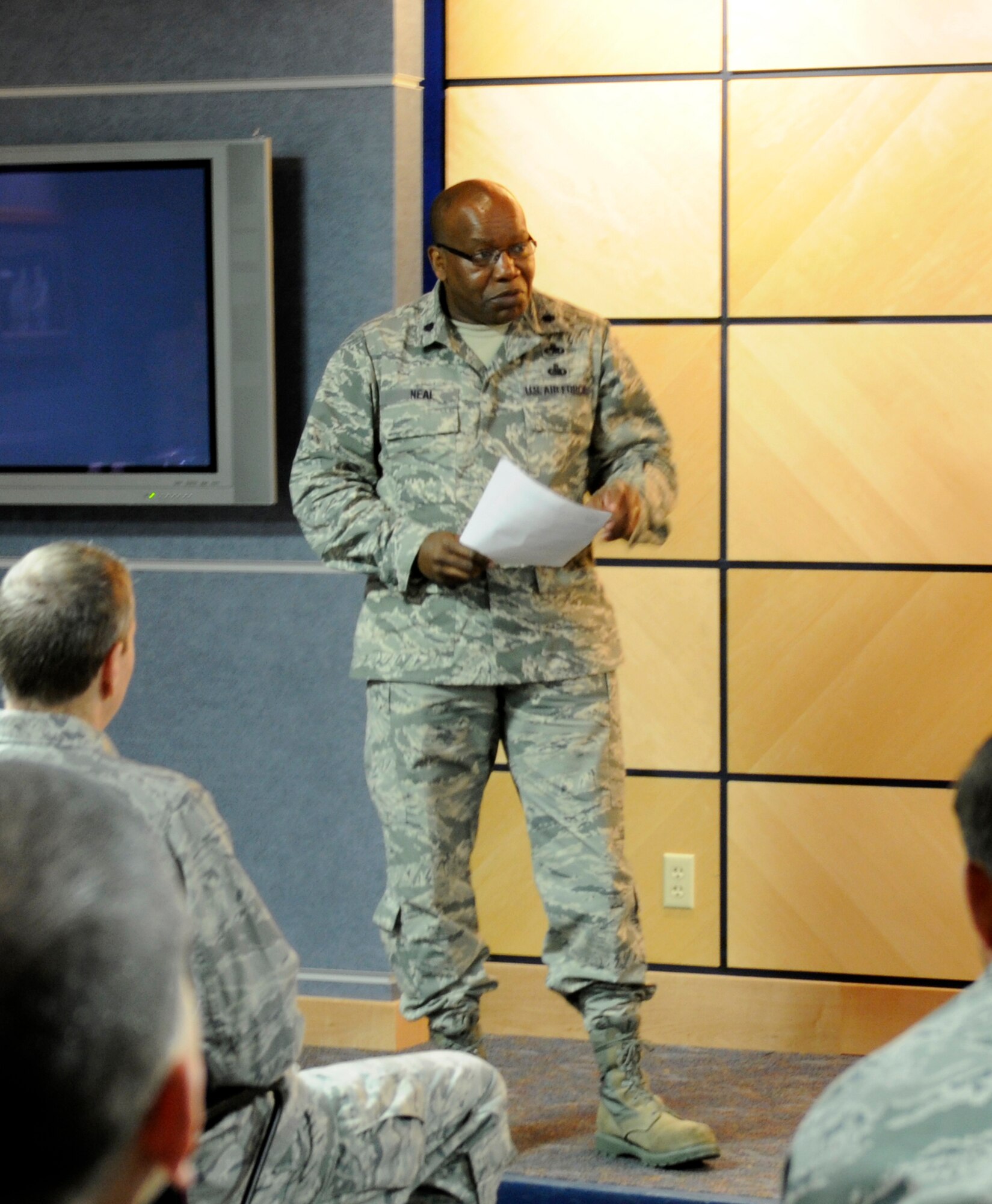 Lt. Col. Anderson Neal, 188th Maintenance Group commander, speaks during a promotion ceremony for Chief Master Sgt. Kenneth “Dee” Tankersley at the 188th Fighter Wing headquarters auditorium March 6, 2014. (U.S. Air National Guard photo by Tech. Sgt. Josh Lewis/released)