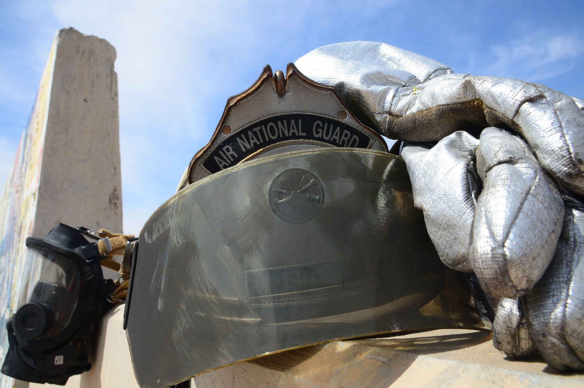 Guard, reserve and active duty Firefighters host a burn trainer event at an undisclosed location in Southwest Asia. Burn Trainer allows senior leaders to gain a better understanding for firefighter duties while deployed to The Rock. (U.S. Air Force photo by Senior Airman Desiree W. Moye)