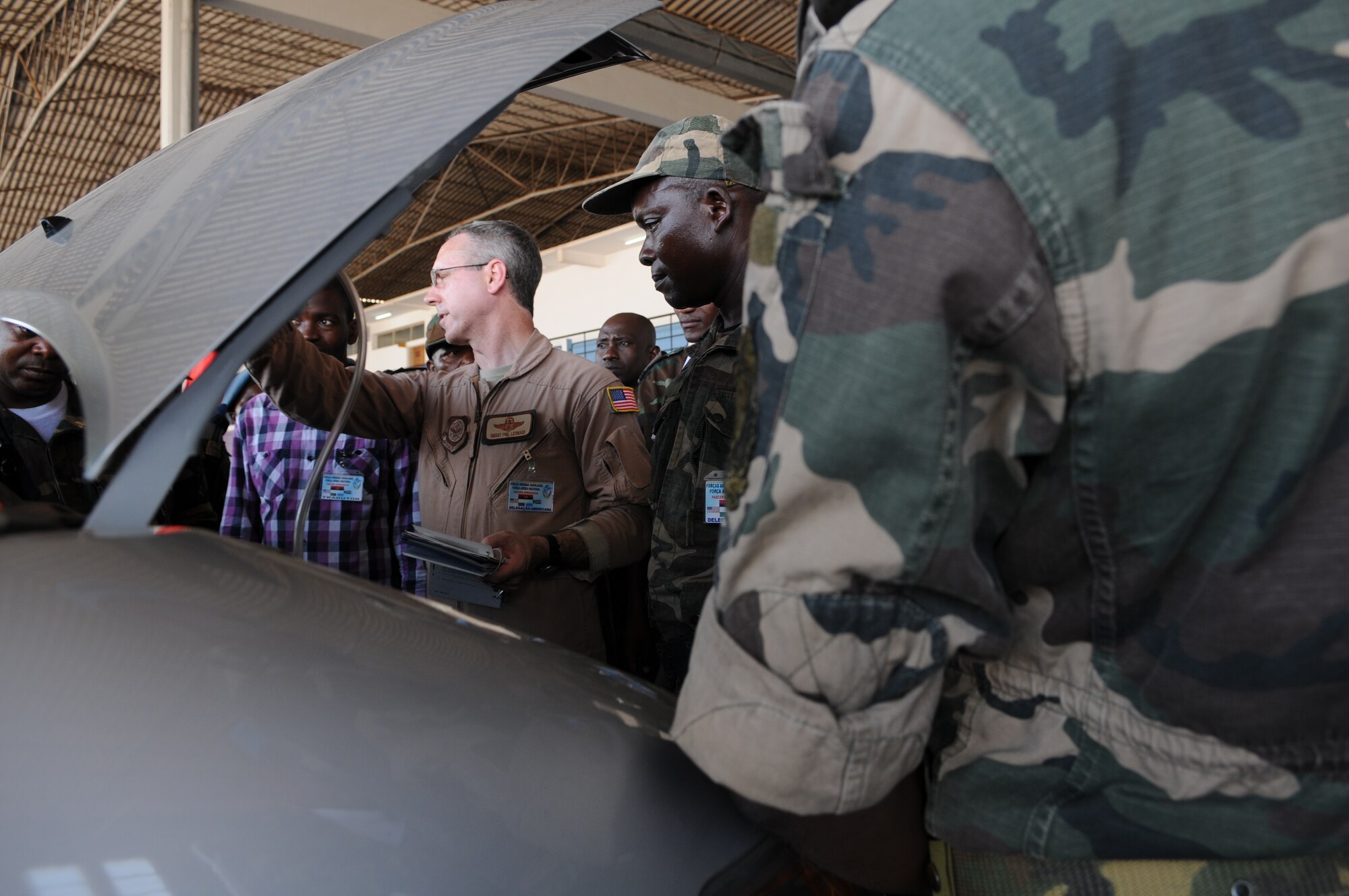 Senior Master Sgt. Phillip Leonard, African Partnership Flight lead planner, leads discussions vehicle inspections March 24, 2014 in Angola, Africa. The intention of APF is to strengthen the regional partnerships within Africa by improving the proficiency and readiness of key mission areas through a collaborative learning environment. (U.S. Air Force photo/Capt. Sybil Taunton)(Released)