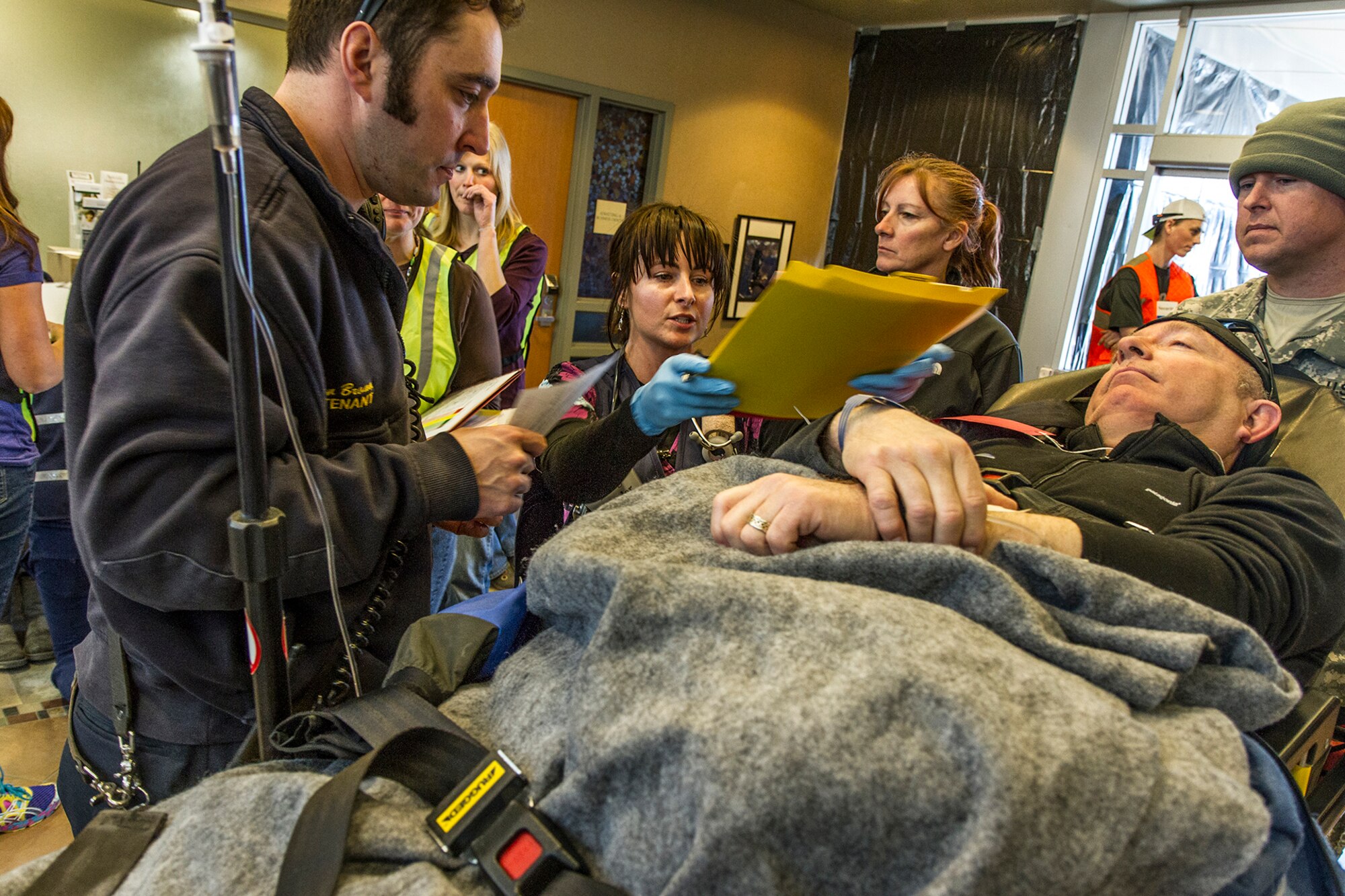 Cindy Clements, a registered nurse and triage lead, admits a patient to the Valdez hospital during exercise Alaska Shield 14 here, March 29, 2014. Alaska Shield 14 is an exercise that involves state, federal, military, and local agencies, designed to test the response and coordination of the disaster modeled after the 1964 earthquake and subsequent tsunami that devastated much of South Central Alaska including the city of Valdez. (U.S. Army photo by Sgt. Benjamin John)