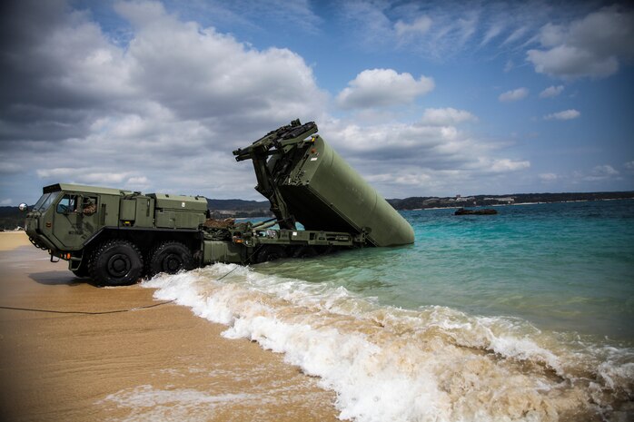 A bay making up the Improved Ribbon Bridge is launched out to sea by the Marine Corps Bridge Pallet system Feb. 7 at Camp Schwab new equipment training. The five days of training enabled the Marines to build on their previous knowledge of bridges and learn the fundamentals of the new IRB. The Marines participating are with 9th Engineer Support Battalion, 3rd Marine Logistics Group