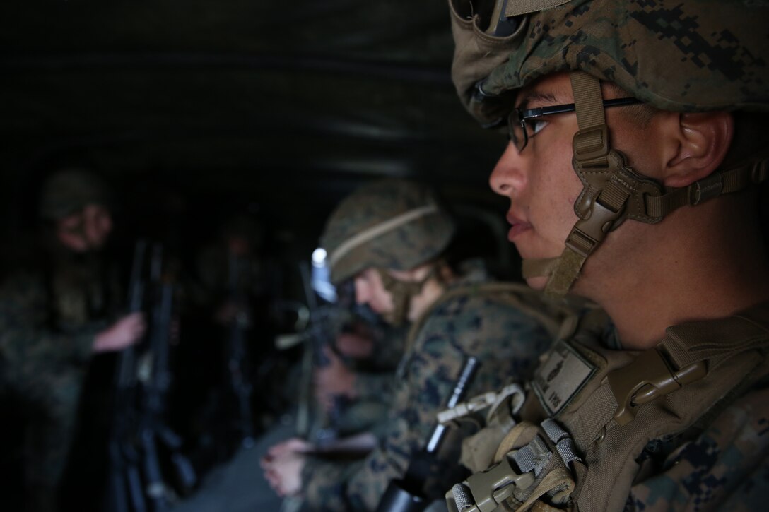 Lance Corporal Juan Sanchez, mortarman, Weapons Company, 3rd Battalion, 8th Marines, assigned to Black Sea Rotational Force, waits as he is being transported by a 7-ton truck to an embarkation point during a contingency response drill.  Contingency response drills are designed to train Marines to be ready at a moment’s notice.  Black Sea Rotational Force 14 is a task force of Marines and sailors with the mission to sustain positive relationships with partner nations uphold regional stability and increase military operational capabilities while also proving the ability for rapid crisis response in the Black Sea, Balkan and Caucasus regions of Eastern Europe. (Official Marine Corps photo by Staff Sgt. Tanner M. Iskra, 2nd Marine Division Combat Camera, Black Sea Rotational Force/Released)