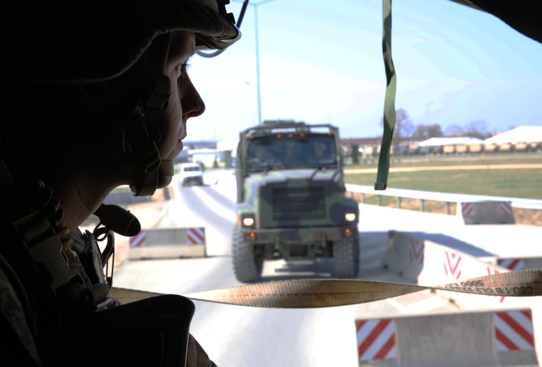 2nd Lieutenant Joseph Kramer,  infantry officer, Weapons Company, 3rd Battalion, 8th Marines, assigned to Black Sea Rotational Force, looks out of the rear of a 7-ton truck as he is being transported to an embarkation point during a contingency response drill.  Contingency response drills are designed to train Marines to be ready at a moment’s notice.  Black Sea Rotational Force 14 is a task force of Marines and sailors with the mission to sustain positive relationships with partner nations uphold regional stability and increase military operational capabilities while also proving the ability for rapid crisis response in the Black Sea, Balkan and Caucasus regions of Eastern Europe. (Official Marine Corps photo by Staff Sgt. Tanner M. Iskra, 2nd Marine Division Combat Camera, Black Sea Rotational Force/Released)