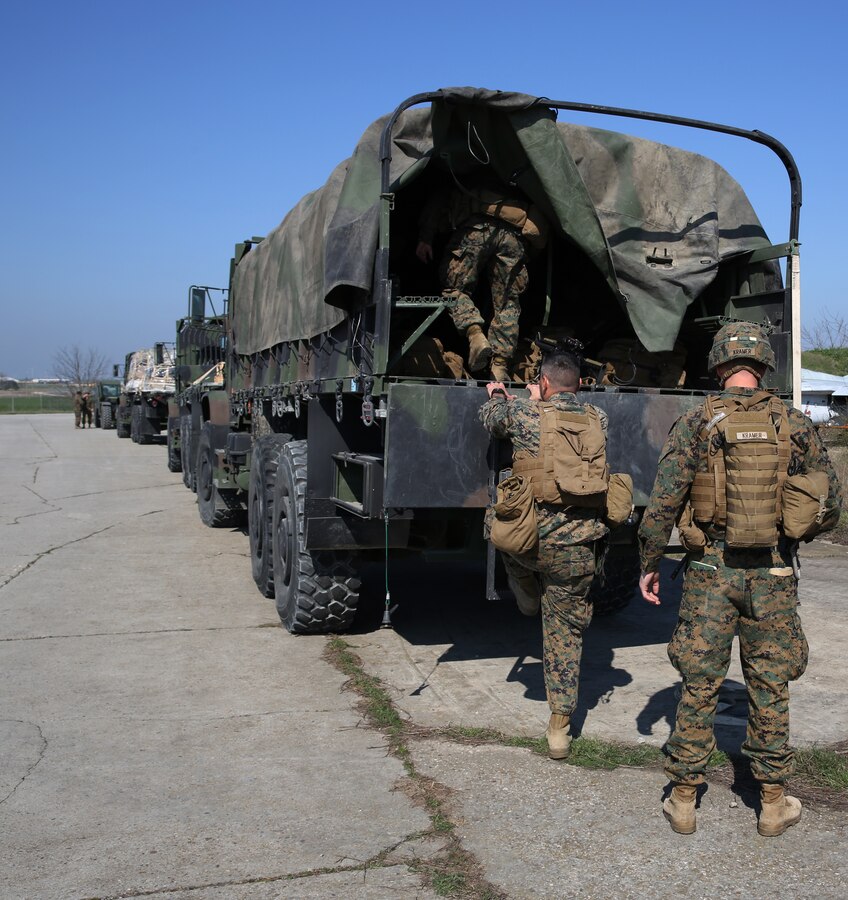 (From right to left) 2nd Lieutenant Joseph Kramer, infantry officer 3rd Battalion, 8th Marines, assigned to Black Sea Rotational Force and Gunnery Sergeant Matthew Richey, mortarman, 3rd Battalion, 8th Marines, assigned to Black Sea Rotational Force load onto a 7-ton truck during a contingency response drill.  Contingency response drills are designed to train Marines to be ready at a moment’s notice.  Black Sea Rotational Force 14 is a task force of Marines and sailors with the mission to sustain positive relationships with partner nations uphold regional stability and increase military operational capabilities while also proving the ability for rapid crisis response in the Black Sea, Balkan and Caucasus regions of Eastern Europe. (Official Marine Corps photo by Staff Sgt. Tanner M. Iskra, 2nd Marine Division Combat Camera, Black Sea Rotational Force/Released)