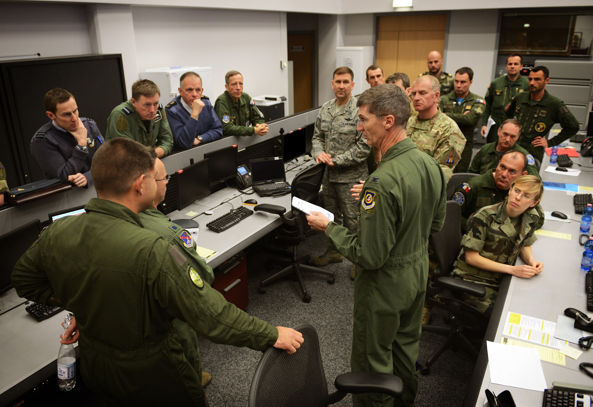 Col. Jeff Marker, 603d Air and Space Operations Center commander, briefs a combined team of French, United Kingdom and U.S. airmen after the completion of exercise Tonnerre Lightning 14-1 March 28, 2014, at Ramstein Air Base, Germany. The exercise is the first in a series of semi-annual exercises between the NATO countries to improve interoperability and communication in the event of a real-world scenario.  (U.S. Air Force photo/Staff Sgt. Ryan Crane)