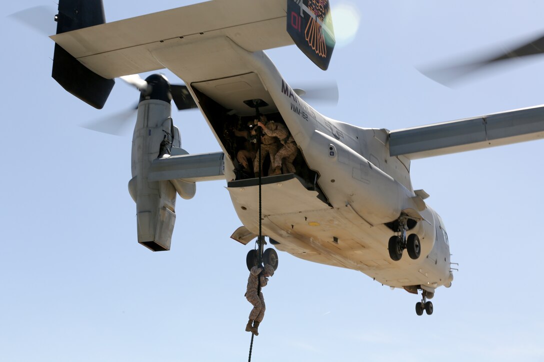 U.S. Marines of Special-Purpose Marine Air-Ground Task Force Crisis Response conduct helicopter rope suspension training aboard Moron Air Base, Spain, March 27, 2014. The training maintains and enhances SP-MAGTF Crisis Response's ability to rapidly respond to a broad range of crises throughout the U.S. Africa Command area of responsibility. (U.S. Marine Corps photo by Lance Cpl. Alexander Hill/Released)
