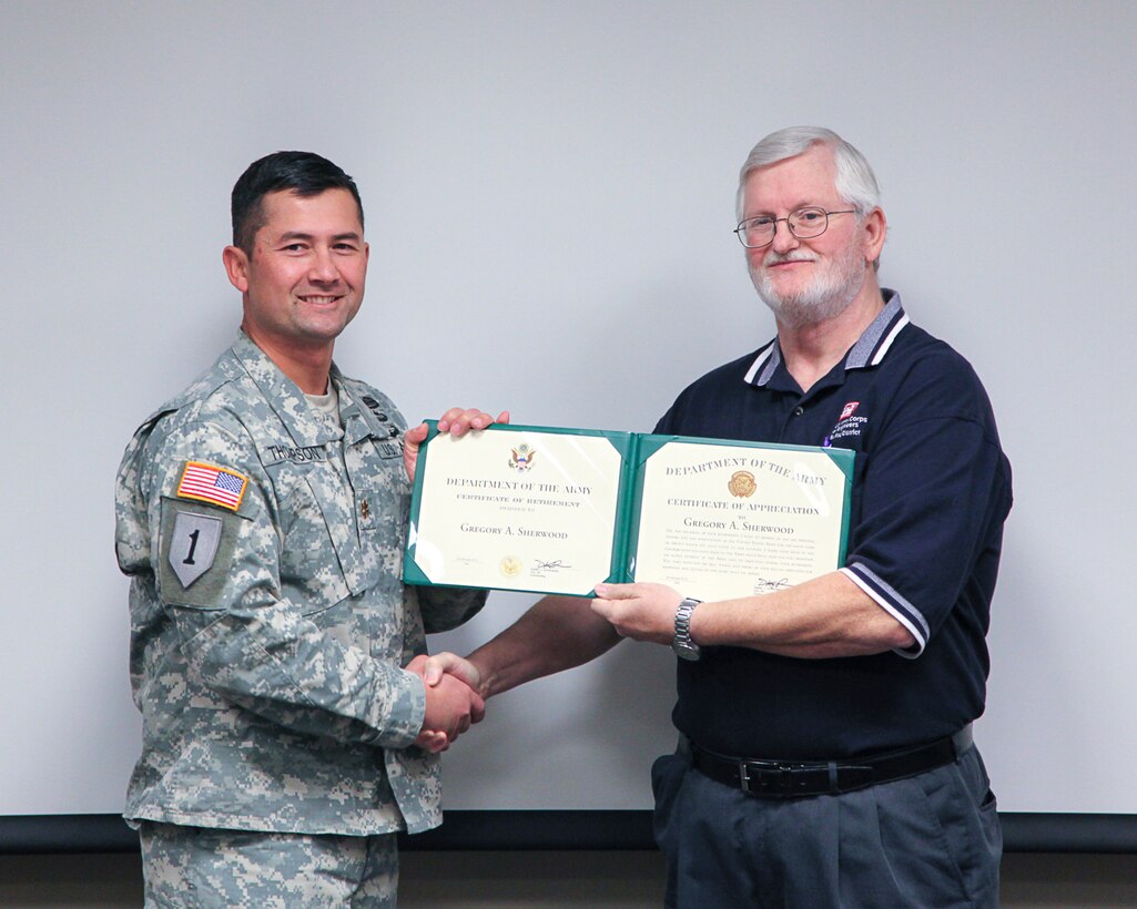 Gregory Sherwood, resource management, retired from the U.S. Army Corps of Engineers, St. Paul District, on Feb. 27, 2014. Maj. Chris Thompson, deputy district engineer, presented Greg with his retirement certificate.