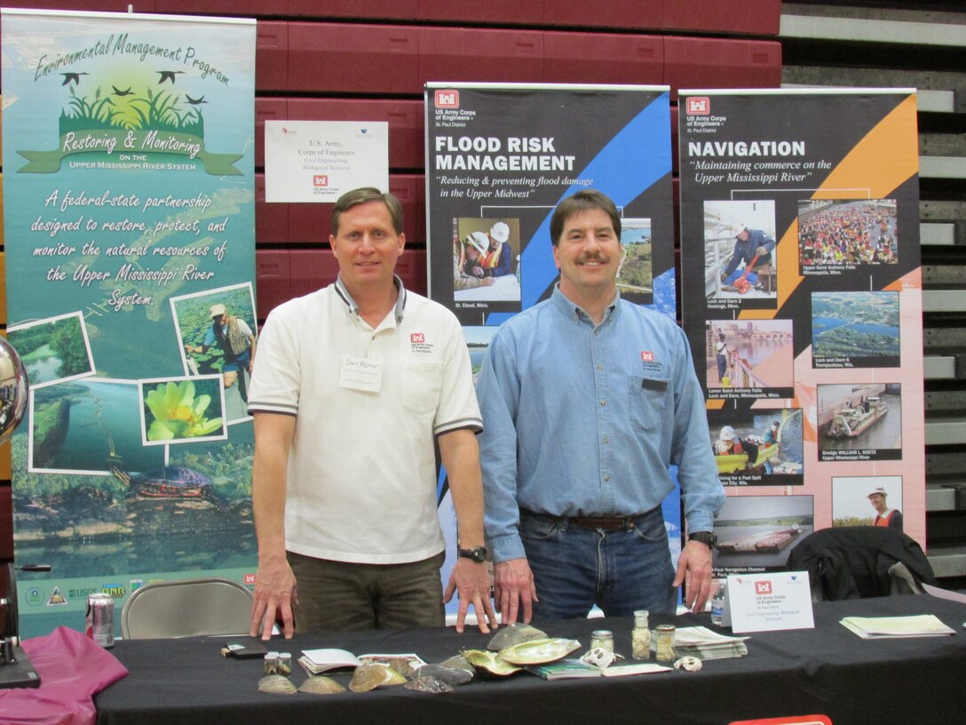 U.S. Army Corps of Engineers, St. Paul District, employees Dan Kelner, biologist, and Tom Sully, civil engineer, participate in a career fair at Irondale High School in New Brighton, Minn., in March 2014.