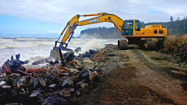 Corps emergency responders deployed to Taholah, Wash., beginning March 25 to perform emergency repairs to a damaged seawall.  They built an access ramp to allow equipment onto the seawall, removed the capstones, and installed a filter blanket and armor rock.  The team worked around the clock to complete repairs to the seawall before high tides peaked Saturday afternoon. 