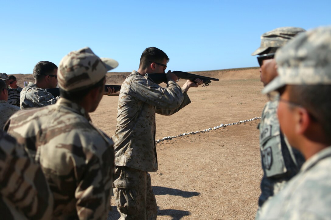 During a nonlethal weapons employment and familiarization, Sgt. Matthew Albano, a military policeman from 2nd Law Enforcement Battalion and Dalton, Mass. native, demonstrates the Remington M500 shotgun to a contingent of Royal Moroccan Armed Forces and U.S. Army and Air Force military police personnel. Nonleathal weapons employment and escalation-of-force operations are an integral part of military operations to prevent the loss-of-life while maintaining civil disorder. During the evolution, Royal Moroccan Armed Forces soldiers, and U.S. military policemen from the Marines, Army and Air Force combined to refine a share their escalation-of-force tactics and procedures while building military partnerships and international friendships. 

