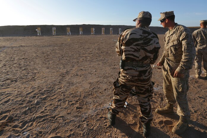 From an M203 launcher, Cpl. Jacob W. Swift, a military policeman with 2nd Law Enforcement Battalion and Lowell, Mich., native, helps a Royal Moroccan Armed Forces soldier shoot a foam baton during a nonleathal weapons familiarization range. Nonleathal weapons employment and escalation-of-force operations are an integral part of military operations to prevent the loss-of-life while maintaining civil disorder. During the evolution, Royal Moroccan Armed Forces soldiers, and U.S. military policemen from the Marines, Army and Air Force combined to refine a share their escalation-of-force tactics and procedures while building military partnerships and international friendships. 
