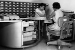 Aerial Film Control Files: Two clerks at work on aerial film control files at DIA in the 1960s. 