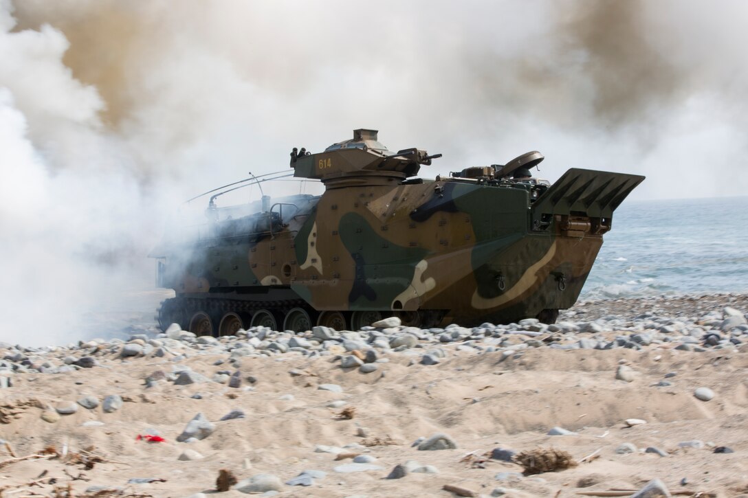 South Korean Assault Amphibious Vehicle emerges to shore from smoke screan during an Intergraded Amphibious Assault for Ssang Yong 14 at Doksu-ri Beach, Pohang, South Korea, March 31, 2014. Exercise Ssang Yong is conducted annually in the Republic of Korea (ROK) to enhance interoperability between U.S. and ROK forces by performing a full spectrum of amphibious operations while showcasing sea-based power projection in the Pacific. (U.S. Marine Corps Photo by Cpl. Sara A. Medina, III MEF Combat Camera/Released)