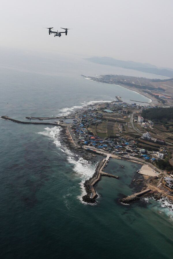 MV-22B Osprey with Marine Medium Tiltrotor Squadron 166 Reinforced flies over Dokseoki-ri beach during exercise Ssang Yong 14, Pohang, South Korea, March 31, 2014. Exercise Ssang Yong is conducted annually in the ROK to enhance interoperability between U.S. and ROK forces by performing a full spectrum of amphibious operations while showcasing sea-based power projection in the Pacific. (U.S. Marine Corps photo by Cpl. Lauren Whitney/Released)