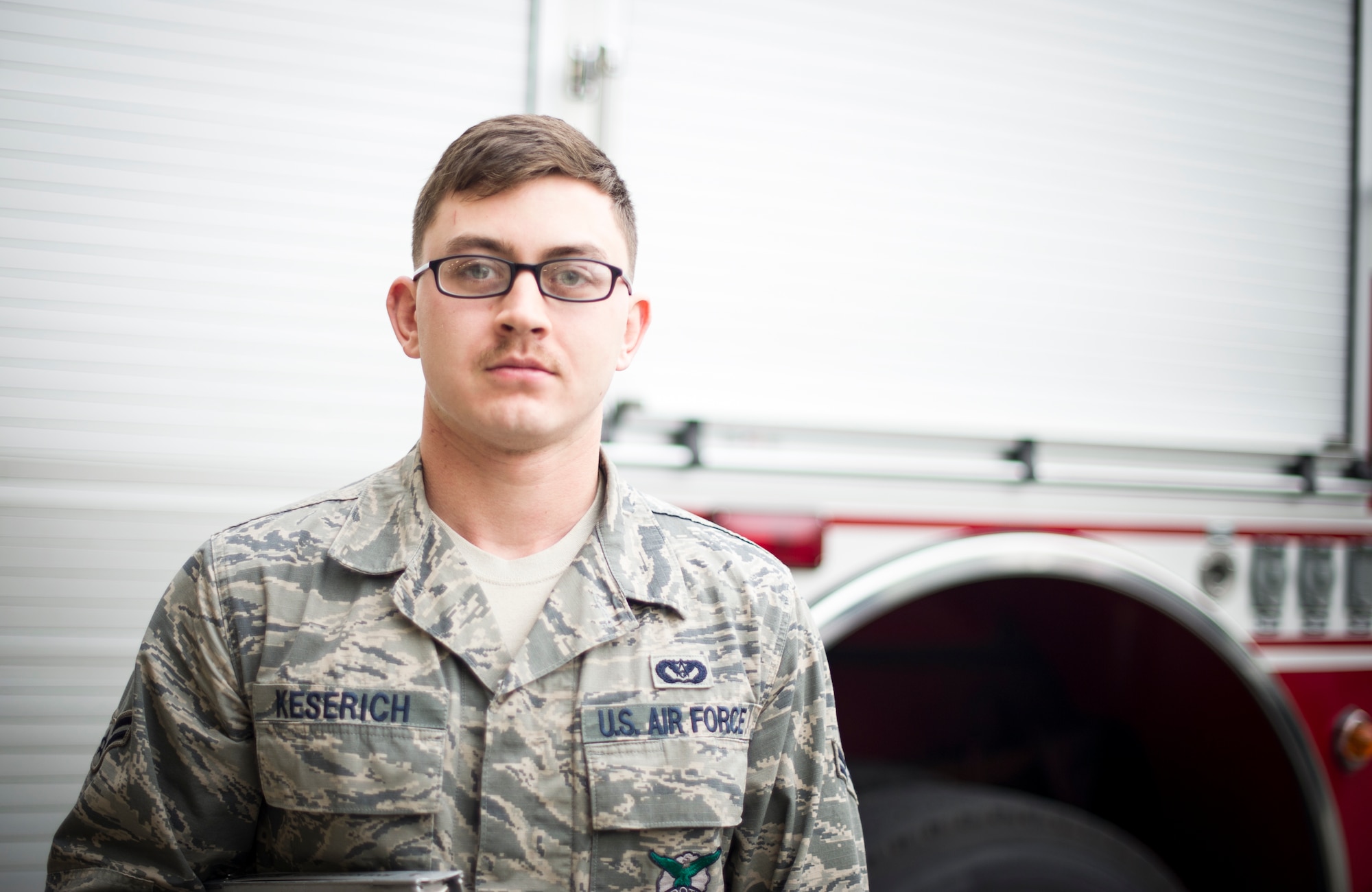 Airman 1st Class Ross Keserich, 374th Civil Engineer Squadron, fire fighter, participates in mustache March at Yokota Air Base, Japan, March 28, 2014. Mustache March is annual event occurring in the month of March, where men in the United States Air Force grow mustaches to honor Air Force legend General Robin Olds. (U.S. Air Force photo by Staff Sgt. Stacy Moless)