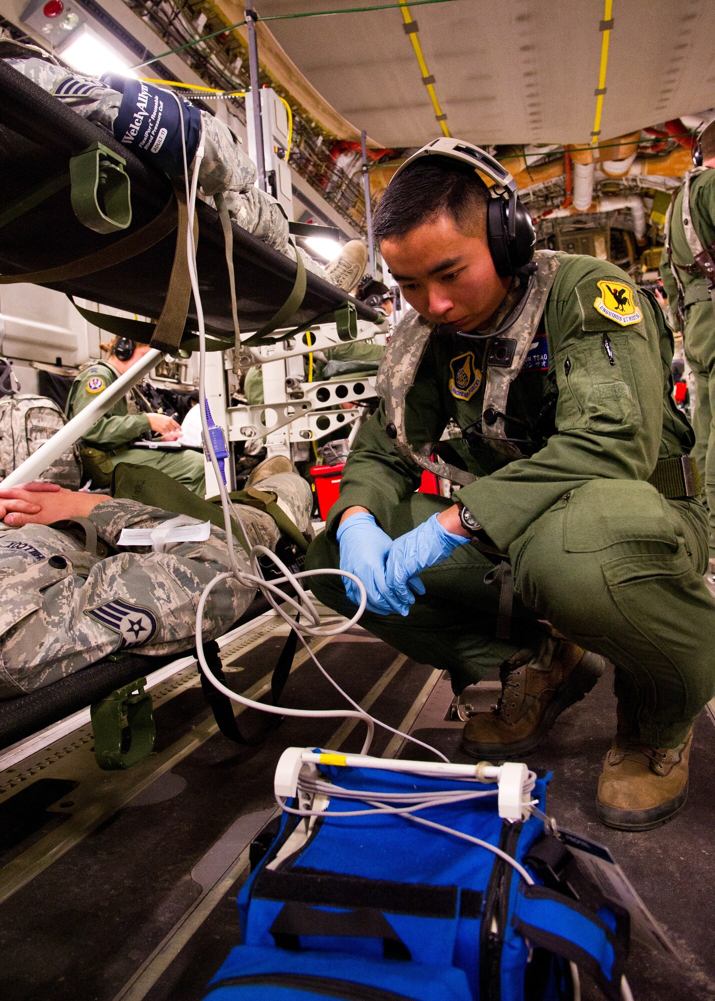 U.S. Air Force Capt. Noelle Deruiter, flight nurse, from the 18th Aeromedical Evacuation Squadron, Kadena Air Base, Okinawa, Japan, checks the defibrillator monitor during a field exercise at the Joint Readiness Training Center (JRTC), Alexandria, La., March 13, 2014. Service members at JRTC 14-05 are educated in combat patient care and aeromedical evacuation in a simulated combat environment. (U.S. Air Force photo by Staff Sgt. Joseph Araiza) 