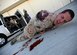 An Airman screams for help while wearing moulage to simulate losing an arm during an active shooter exercise at Creech Air Force Base, Nev., March 25, 2014. The exercise with Nellis Air Force Base, Nev., allowed first responders and medical personnel to receive realistic training. (U.S. Air Force photo by Staff Sgt. N.B./Released)