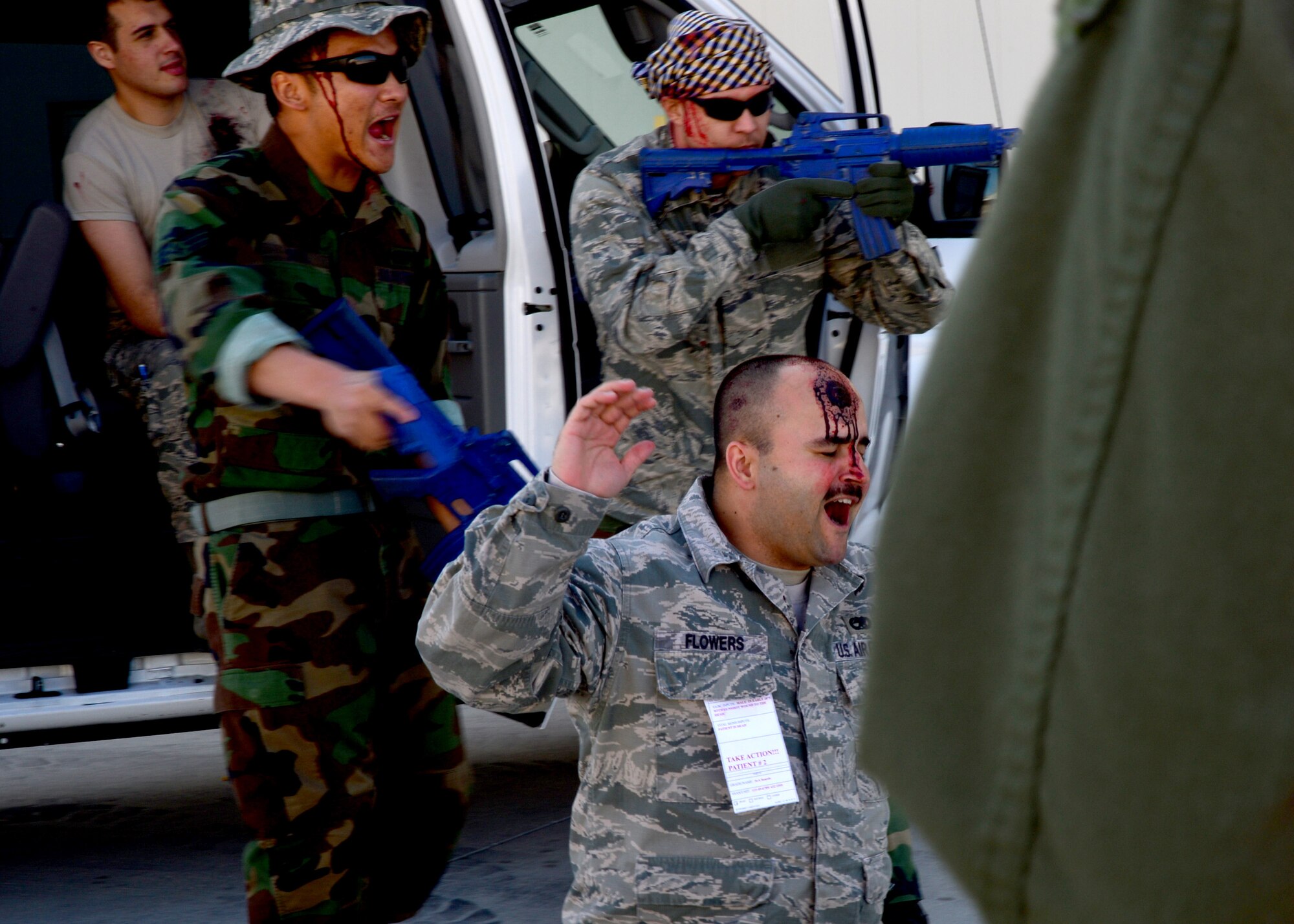 An Airman wears moulage to simulate a head injury during an active shooter exercise at Creech Air Force Base, Nev., during a simulated active shooter exercise March 25, 2014. The exercise was collaboration with Nellis Air Force Base, Nev., to test the capabilities of installation personnel, first responders and critical emergency communication infrastructures. (U.S. Air Force photo by Staff Sgt. N.B./Released)