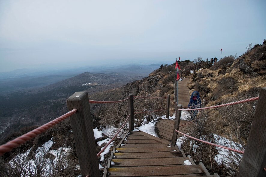 Hikers ascend the steps on one of the hiking trails of Hallasan Mountain March 9, 2014, in Jeju Island, Republic of Korea. The mountain is located in Hallasan National Park, and has seven trails of various lengths. Located centrally in Jeju, the height of the mountain offers broad panoramic views of the island. (U.S. Air Force photo by Staff Sgt. Jake Barreiro)