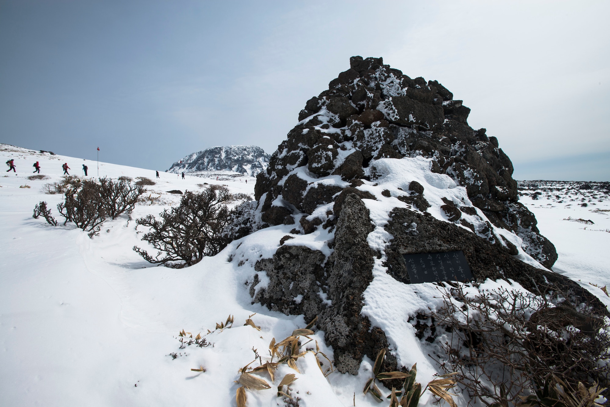 Travelers hike up Hallasan Mountain March 9, 2014, in Jeju Island, Republic of Korea. At 6,398 feet, Hallasan Mountain is the tallest mountain Korea. (U.S. Air Force photo by Staff Sgt. Jake Barreiro)
