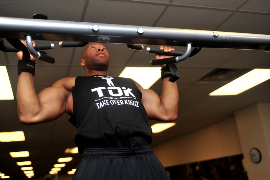 U.S. Air Force Tech. Sgt. Thomas Canada, 27th Special Operations Support Squadron NCO in charge of training, works out March 26, 2014 at the fitness center at Cannon Air Force Base, N.M. Canada stays active while stationed at Cannon by entering bodybuilding competitions within the state of New Mexico. (U.S. Air Force Photo/Senior Airman Xavier Lockley)