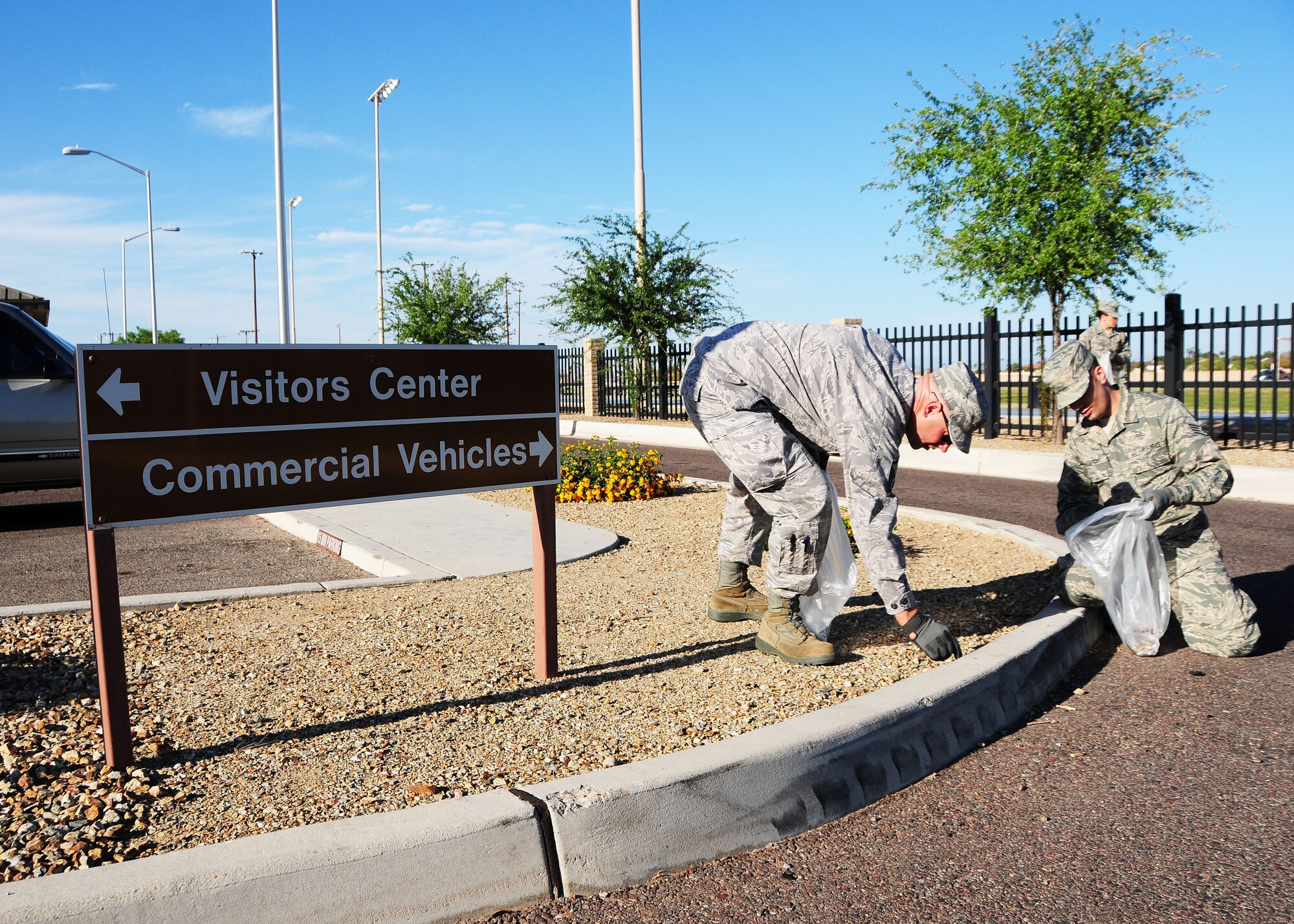 944th Aeromedical Staging Squadron members pick up trash March 22 at the South Gate Visitor Reception Center as part of a community service team at Luke Air Force Base, Ariz. (U.S. Air Force phot taken by Tech. Sgt. Louis Vega Jr.)