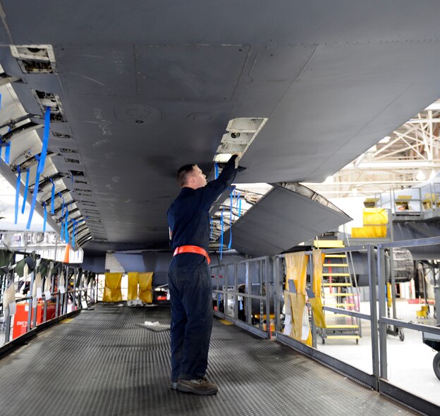 U.S. Air Force Airman 1st Class Alex Bloom, 7th Equipment Maintenance Squadron, inspects the interior of a B-1B Lancer wing March 27, 2014, at Dyess Air Force Base, Texas. The wings of a B-1B Lancer are closely inspected to ensure there is no structural damage. (U.S. Air Force photo by Airman 1st Class Alexander Guerrero/Released)