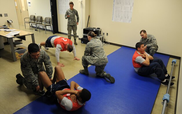Airmen conduct fitness tests in the physical fitness test facility at Fairchild Air Force Base, Wash., March 27, 2014. The maximum allowed to test per session is 12 personnel. (U.S. Air Force photo by Airman 1st Class Janelle Patiño/Released)