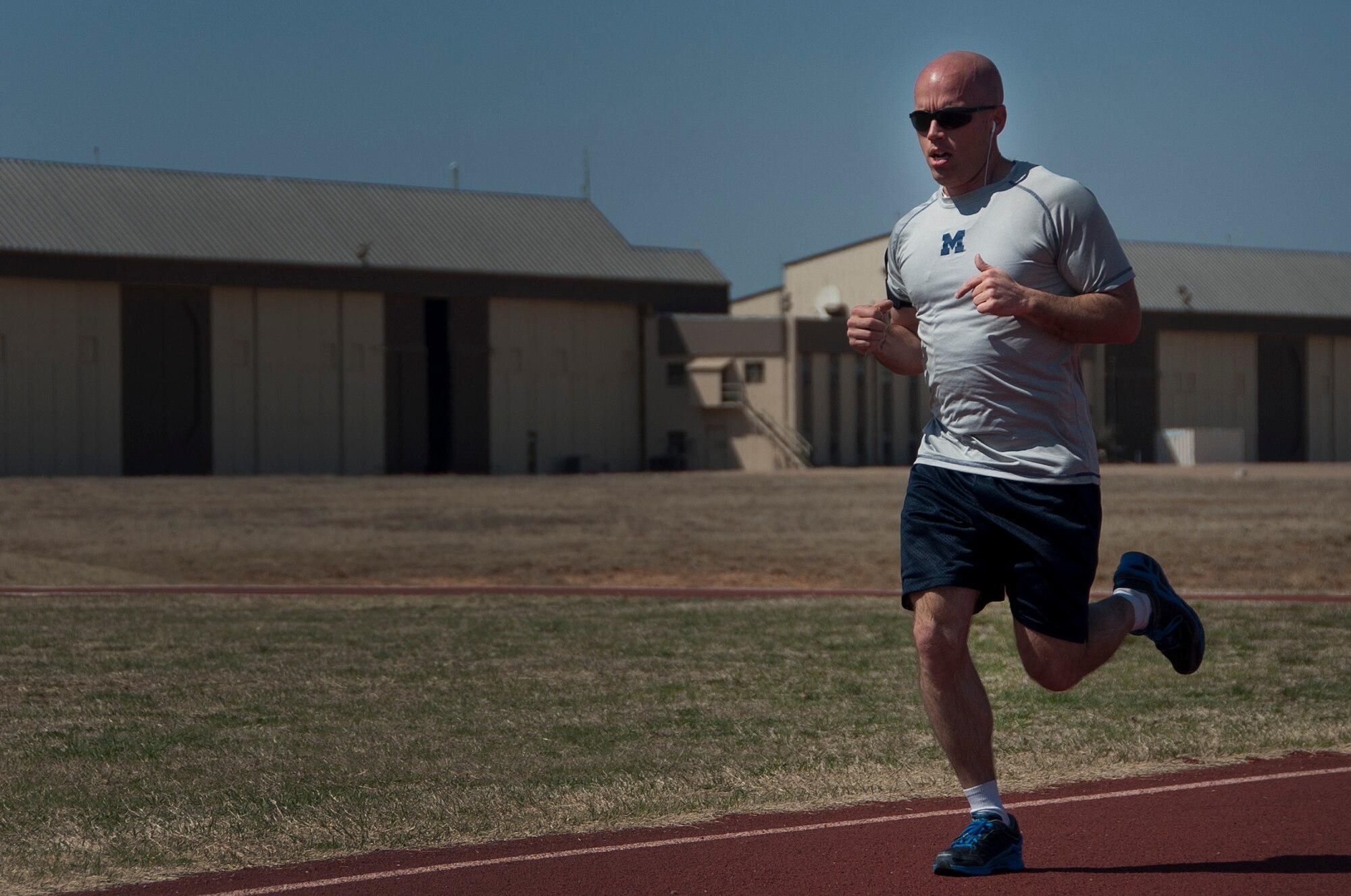 Master Sgt. Derek A. Dingle, 82nd Comptroller Squadron acting first sergeant, pushes himself toward the finish line at Sheppard Air Force Base, Texas, during the Air Force Assistance Fund 5k run, March 24, 2014. The AFAF is one of only two official Air Force fundraisers that aims to provide support to Air Force personnel and their families. (U.S. Air Force photo/Airman 1st Class Robert L. McIlrath)