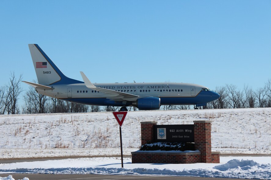 Snowing again?  April fools!  No, but this was a few short weeks ago in March as a final (?) winter blast made an interesting "drive by" photo of the 932nd Airlift Wing's C-40C passing by the welcome sign to the unit.  The forecast for the rest of this week is rainy around Belleville, Ill.  (U.S. Air Force photo/Maj. Stan Paregien).