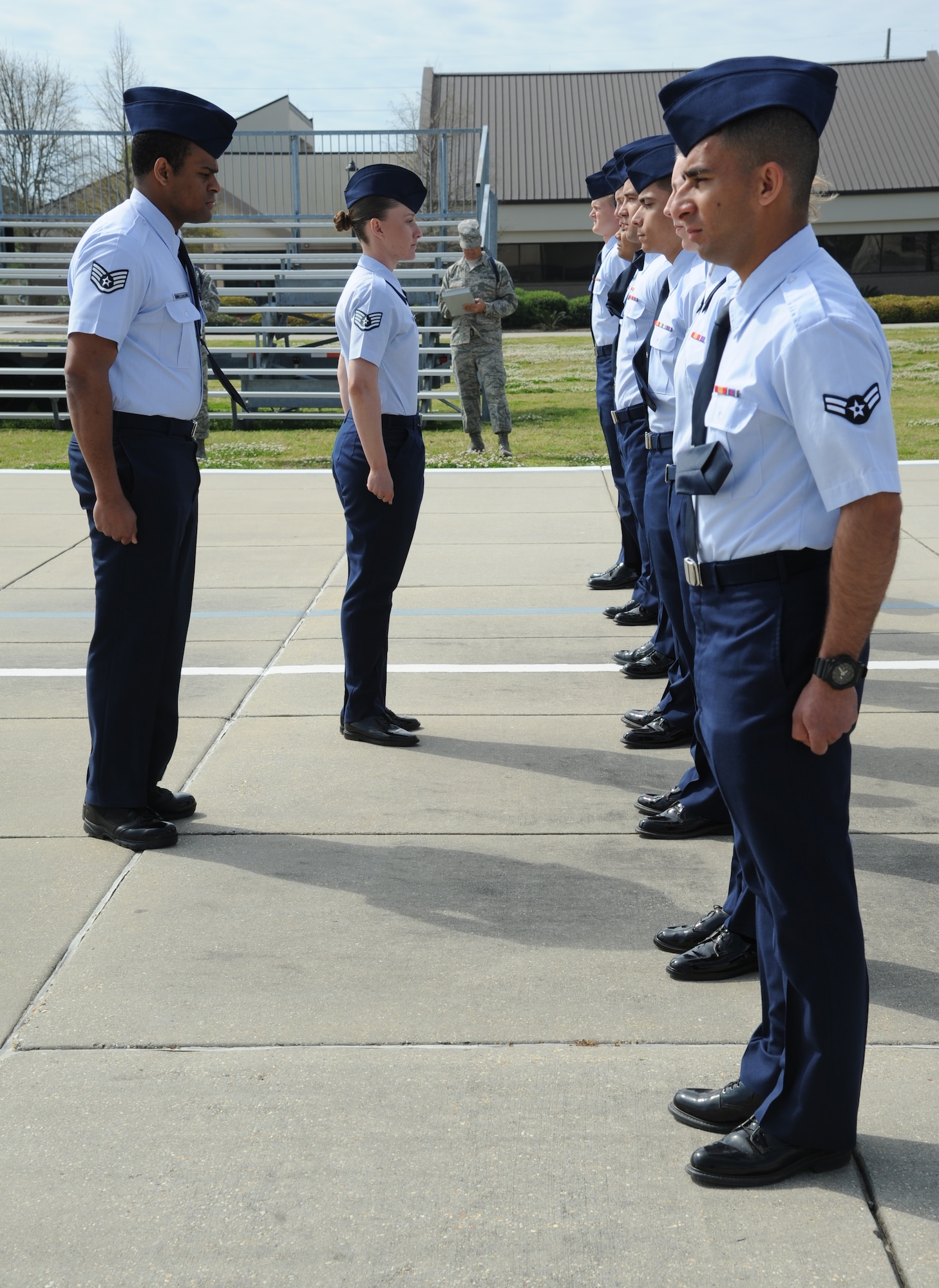 Staff Sgt. Shaun-Darius Martin, 338th Training Squadron, and Staff Sgt. Alexandria Valdez, 335th Training Squadron, conduct an open ranks inspection on a flight of 25 non-prior service students during the second annual Top Tech competition March 27, 2014, at the Levitow Training Support Facility drill pad, Keesler Air Force Base, Miss.  Top Tech is an 81st Training Support Squadron competition that allows instructors to compete with their peers to hone skills and improve the overall instructor and military training leader corps. (U,S. Air Force photo by Kemberly Groue)