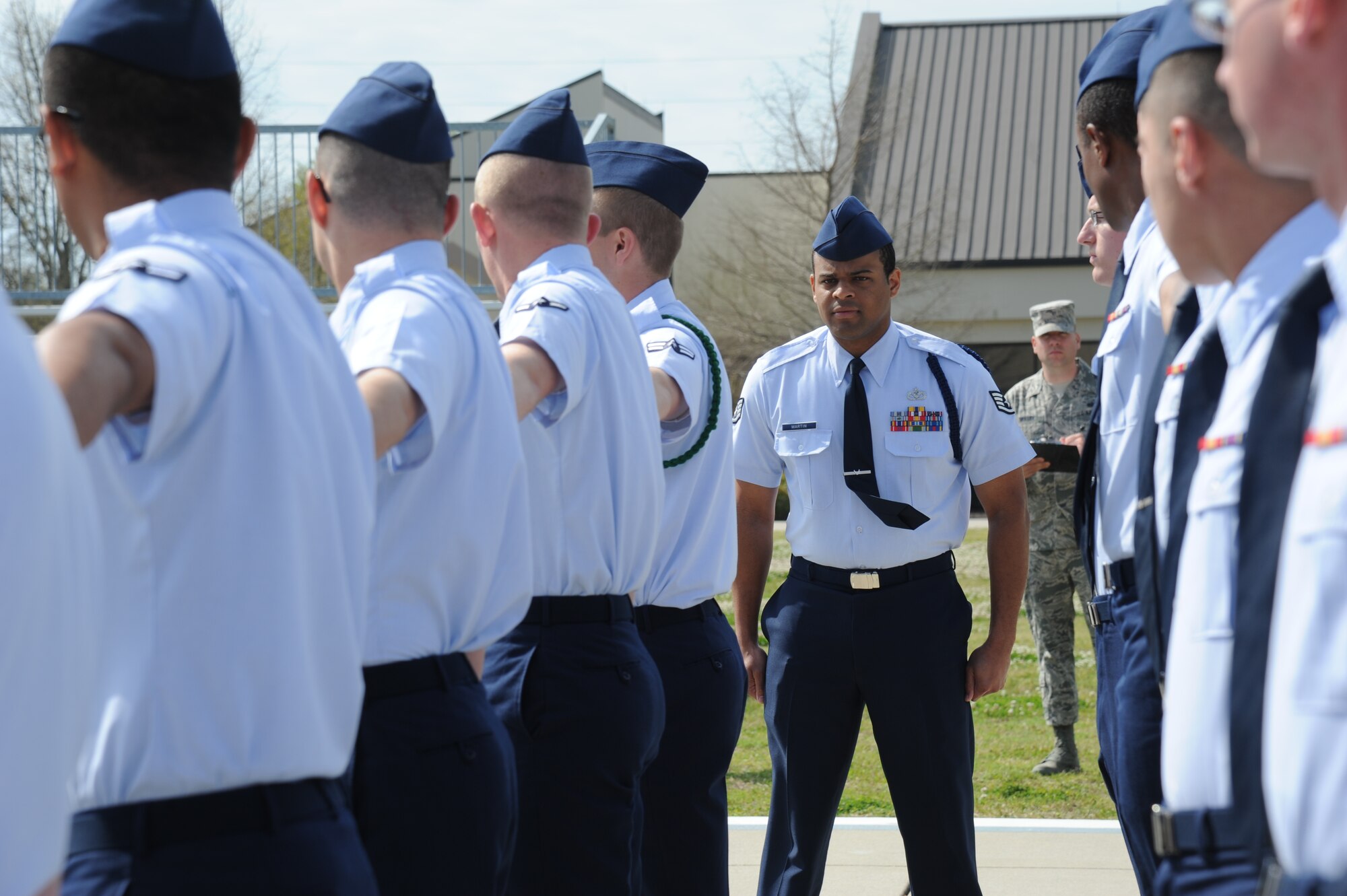 Staff Sgt. Shaun-Darius Martin, 338th Training Squadron, conducts an open ranks inspection on a flight of 25 non-prior service students during the second annual Top Tech competition March 27, 2014, at the Levitow Training Support Facility drill pad, Keesler Air Force Base, Miss.  Top Tech is an 81st Training Support Squadron competition that allows instructors to compete with their peers to hone skills and improve the overall instructor and military training leader corps. (U,S. Air Force photo by Kemberly Groue)