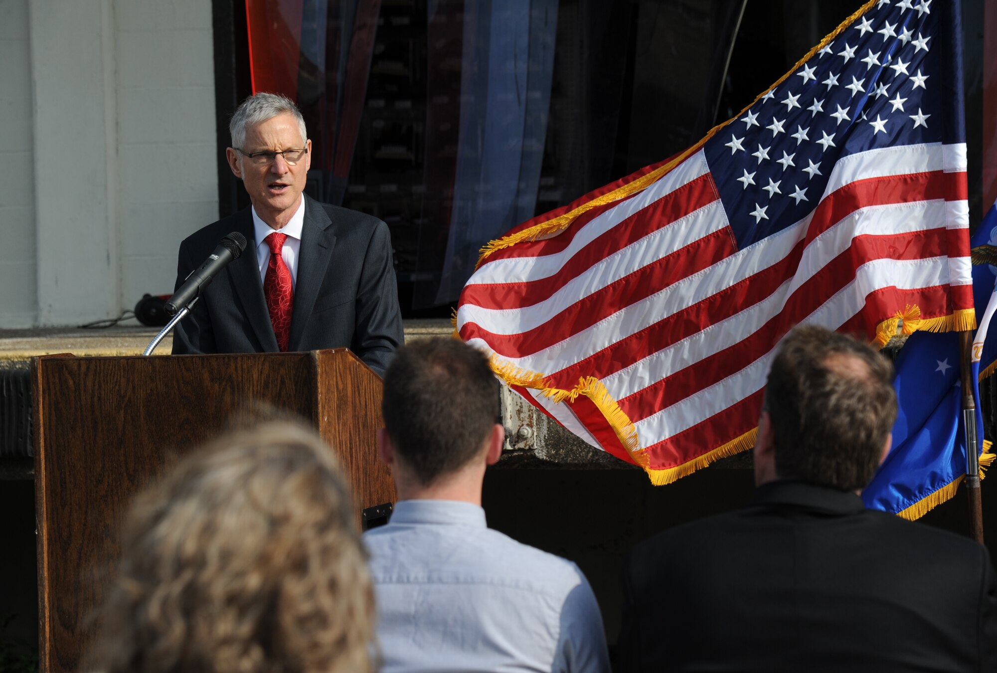 Jeffrey Hawting, L.C. Industries chief operating officer, serves as the master of ceremonies and delivers welcoming remarks during the Ability One Base Supply Center ribbon cutting ceremony March 27, 2014, at Keesler Air Force Base, Miss.  Supply vending tables were on display for the event. (U.S. Air Force photo by Kemberly Groue)