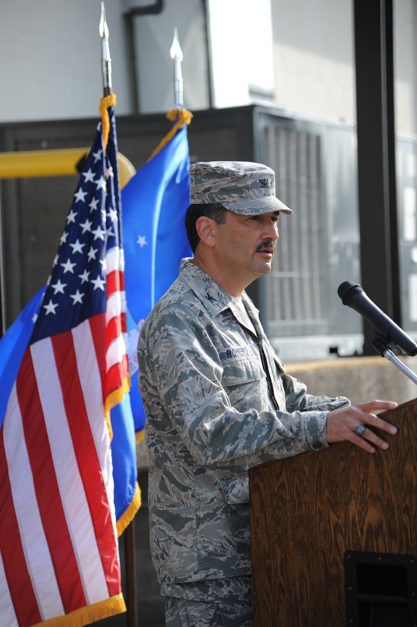Col. René Romero, 81st Training Wing vice commander, makes remarks during the Ability One Base Supply Center ribbon cutting ceremony March 27, 2014, at Keesler Air Force Base, Miss.  Supply vending tables were on display for the event.  (U.S. Air Force photo by Kemberly Groue)
