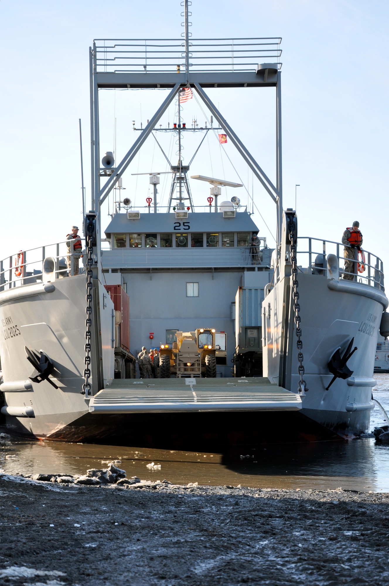 A U.S. Army landing craft utility (LCU) docks at an unimproved ramp during Joint Logistics Over the Shore (JLOTS) training at Port of Anchorage, Alaska, March 29, 2014. Soldiers from Fort Eustis' 7th Transportation Brigade (Expeditionary) joined Service members from various branches of the military to complete the exercise, which entails the loading and unloading of strategic ships when fixed port facilities are unavailable or denied due to enemy activities. (U.S. Army photo by Sgt. Stefanie Warner/Released)