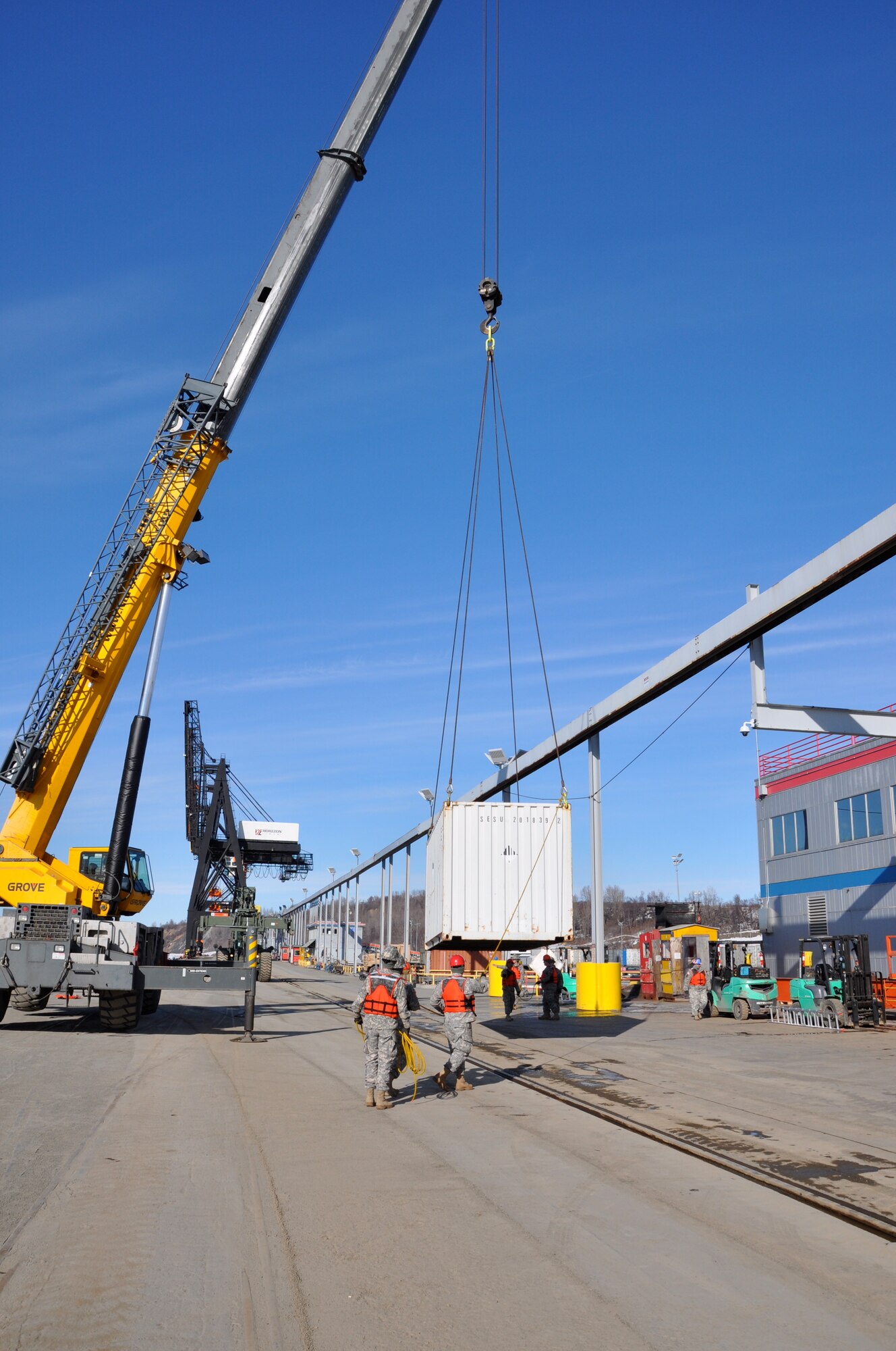 U.S. Army Soldiers assigned to Fort Eustis' 7th Transportation Brigade (Expeditionary) operate a crane to move shipping containers and equipment during a Joint Logistics Over the Shore (JLOTS) exercise at Port of Anchorage, Alaska, March 29, 2014. Soldiers from the 7th Trans. Bde. (Ex.) joined Service members from various branches of the military to complete the exercise, which entails the loading and unloading of strategic ships when fixed port facilities are unavailable or denied due to enemy activities. (U.S. Army photo by Sgt. Stefanie Warner/Released)