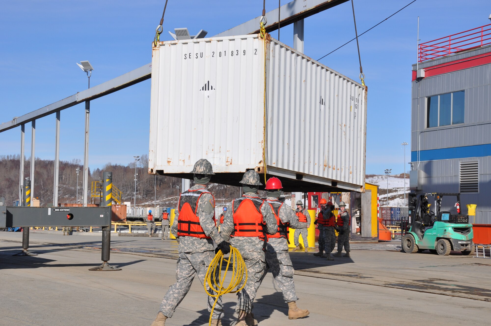 U.S. Army Soldiers assigned to Fort Eustis' 7th Transportation Brigade (Expeditionary) operate a crane to move shipping containers and equipment during a Joint Logistics Over the Shore (JLOTS) exercise at Port of Anchorage, Alaska, March 29, 2014. LOTS operations are conducted over unimproved shorelines, through fixed ports not accessible to deep draft shipping, and through fixed ports that are inadequate without the use of LOTS capabilities. (U.S. Army photo by Sgt. Stefanie Warner/Released)