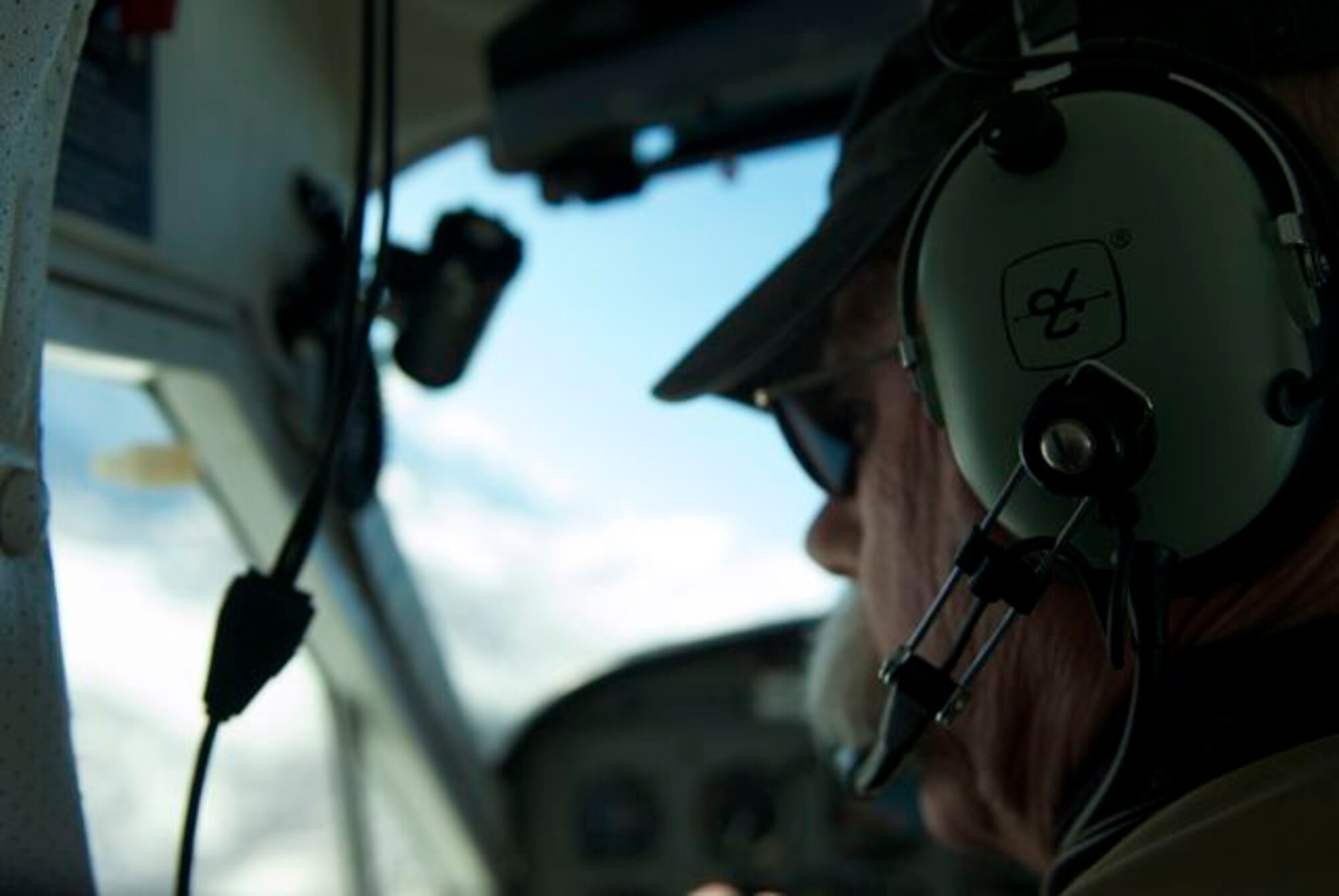 Ron Preston, a Civil Air Patrol mission pilot, flies on a mock damage assessment mission as part of Alaska Shield March 29, 2014. Preston and other volunteers fly photographers over critical infrastructure such as energy facilities and then document damage and send their data to federal officials for analysis. Alaska Shield 14 is an exercise that involves state, federal, military, and local agencies, designed to test response and coordination efforts during a disaster and is modeled after the 1964 earthquake and subsequent tsunami that devastated much of South Central Alaska. (U.S. Army photo by Spc. Ryan A. Swanson)