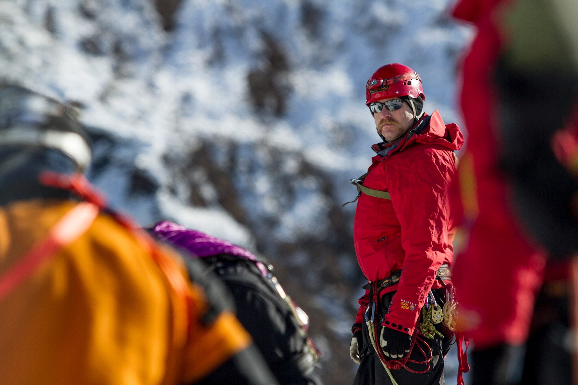 Josh Larsen, a firefighter lieutenant and member of the Back Country Rescue Team with the Valdez Fire Department, sets up the rope-safety system to help rescue a simulated victim that fell into a glacier crevasse during Alaska Shield 14 here, March 30, 2014. Alaska Shield 14 is an exercise that involves state, federal, military and local agencies, designed to test the response and coordination of the disaster modeled after the 1964 earthquake and subsequent tsunami that devastated much of South Central Alaska including the city of Valdez. (U.S. Army photo by Sgt. Benjamin John)