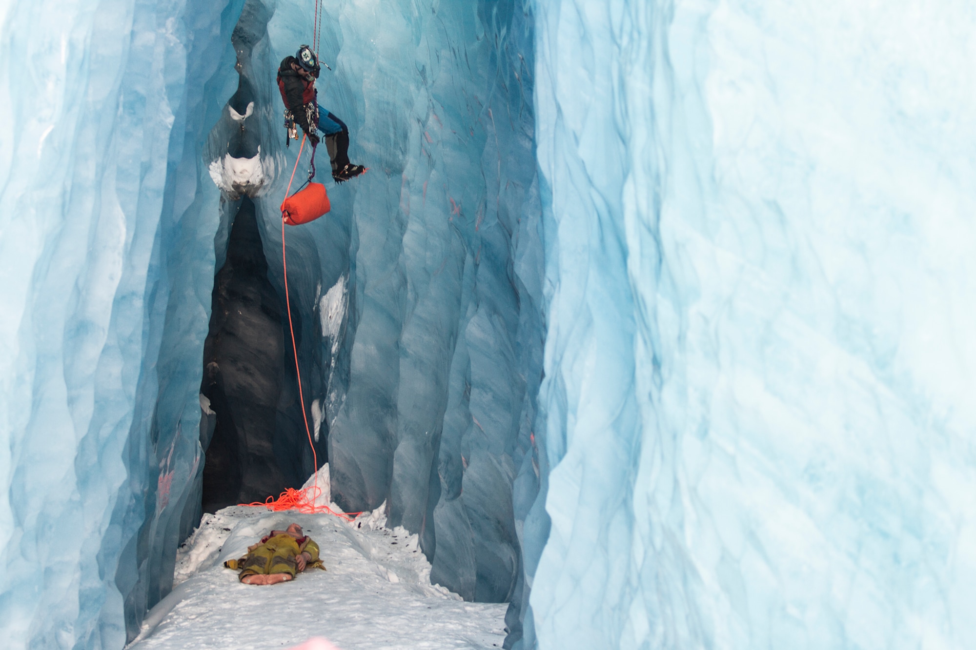 Chris Moulton, a firefighter with the Valdez fire department, climbs inside a glacier crevasse to rescue a simulated victim during Alaska Shield 14 here, March 30, 2014. Alaska Shield 14 is an exercise that involves state, federal, military and local agencies, designed to test the response and coordination of the disaster modeled after the 1964 earthquake and subsequent tsunami that devastated much of South Central Alaska including the city of Valdez. (U.S. Army photo by Sgt. Benjamin John)