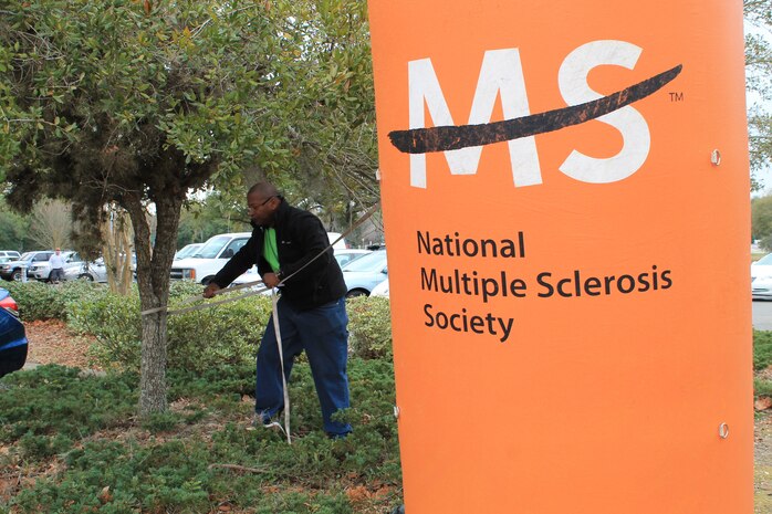 Master Sgt. Young helps with setting up the finish line March 1, 2014, at the Multiple Sclerosis Challenge Walk in Mt Pleasant, S.C. Members of the 841st Transportation Battalion volunteered their time to assist volunteers and participants. 