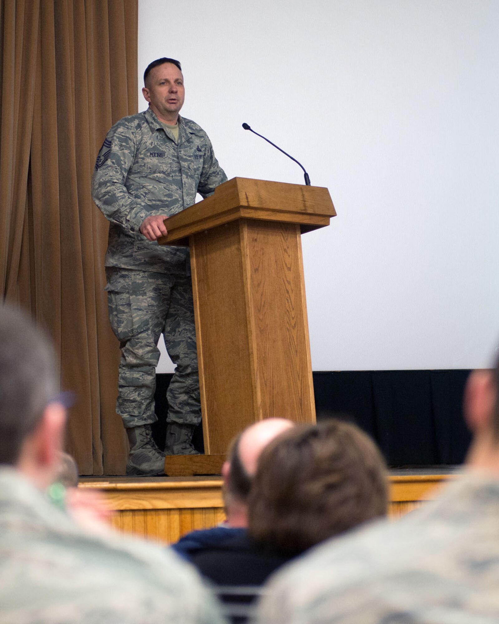 HANSCOM AIR FORCE BASE, Mass. – Chief Master Sgt. Craig A. Poling, installation senior enlisted advisor, speaks to members of the 66th Air Base Group during a commander's call in the base theater March 27. Poling spoke about enlisted programs such as the Development Special Duty, professional military education and more. (U.S. Air Force photo by Mark Herlihy) 